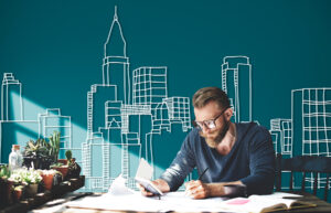 A man planning real estate investment with city background