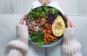 Healthy vegan bowl with avocado, chickpeas, and vegetables