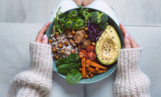 Healthy vegan bowl with avocado, chickpeas, and vegetables