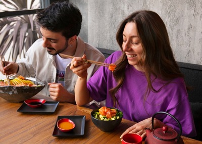Two People Enjoying Korean Food