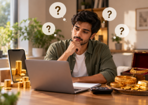 A man considering gold investment options while comparing digital and physical gold, with gold bars, coins and jewellery beside his laptop.